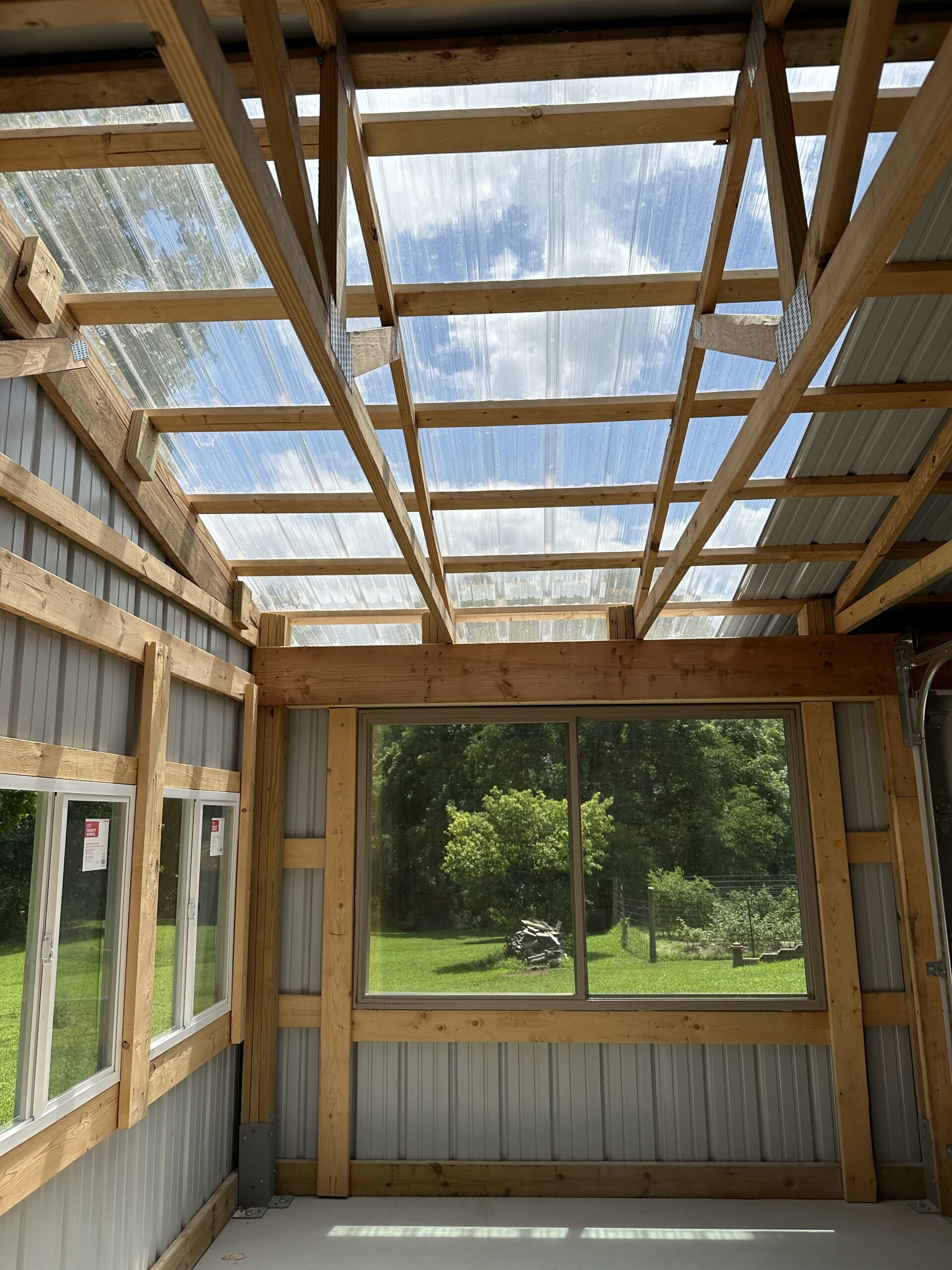 Small outbuilding structure with framing and concrete floor by Williams Construction